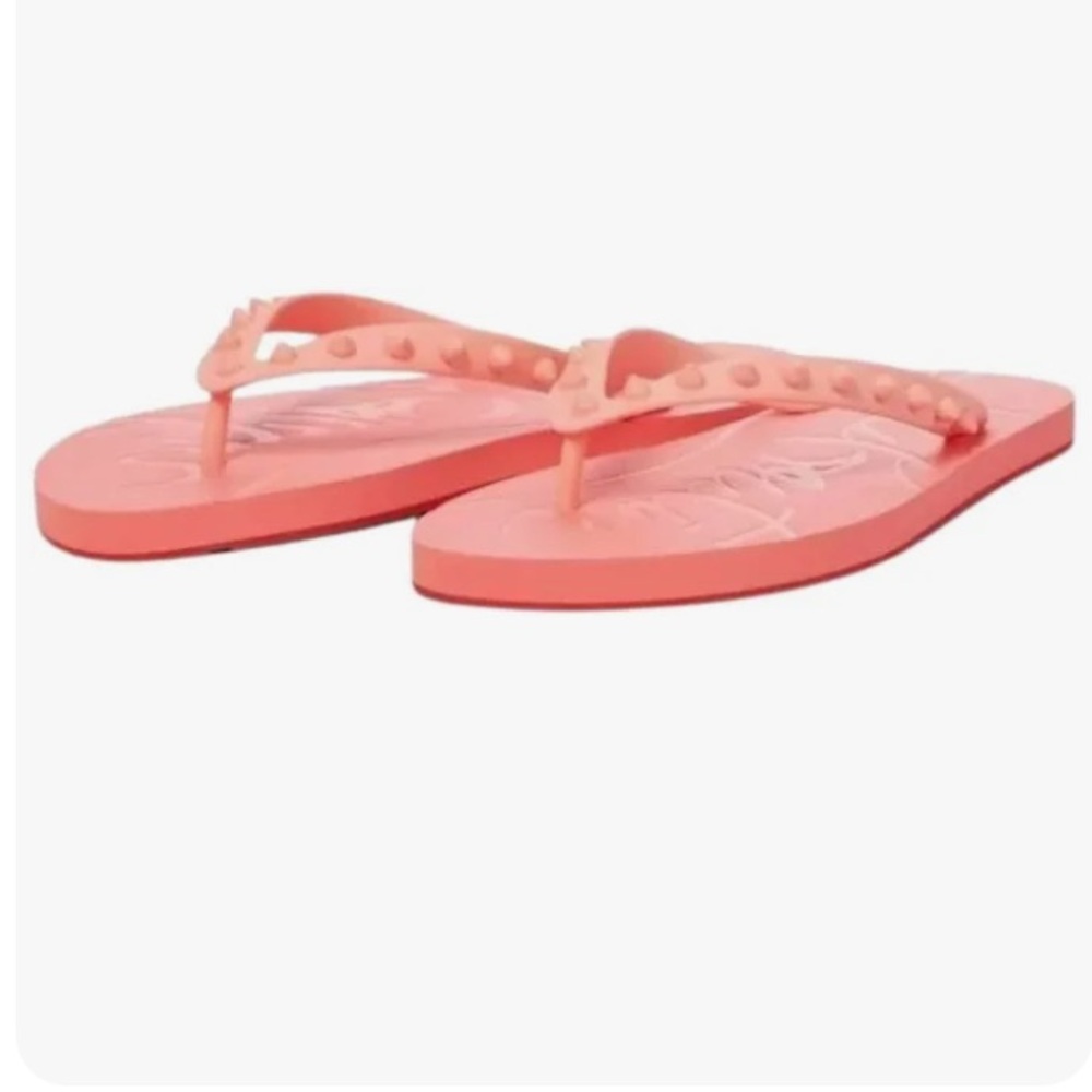 Louboutin Women's Flip-flop
Genuine Leather Rubber w/ Signature Spikes